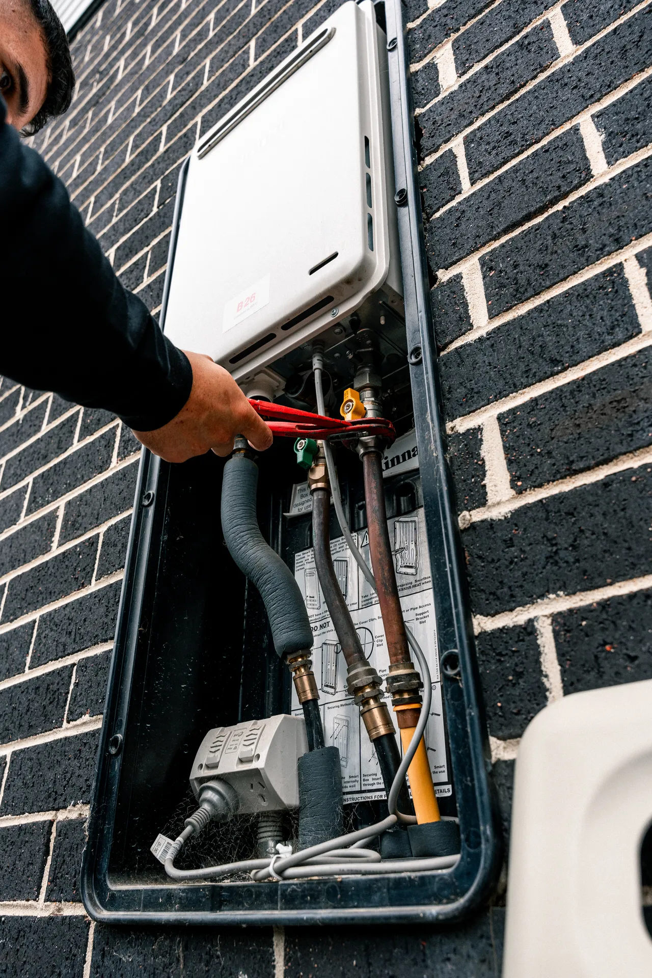 Gas Experts Melbourne technician at work on a gas appliance