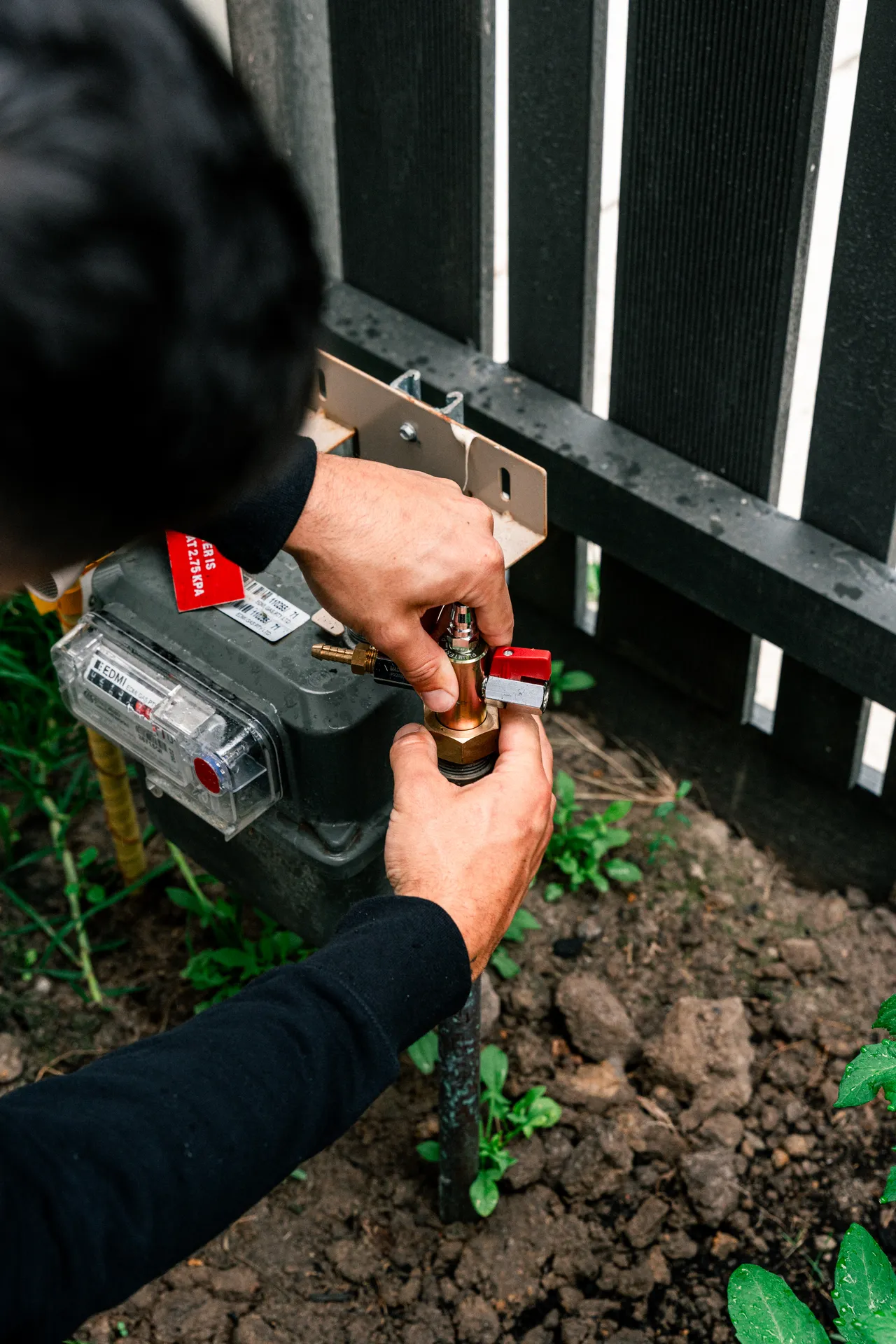 Technician diagnosing a gas heater fault