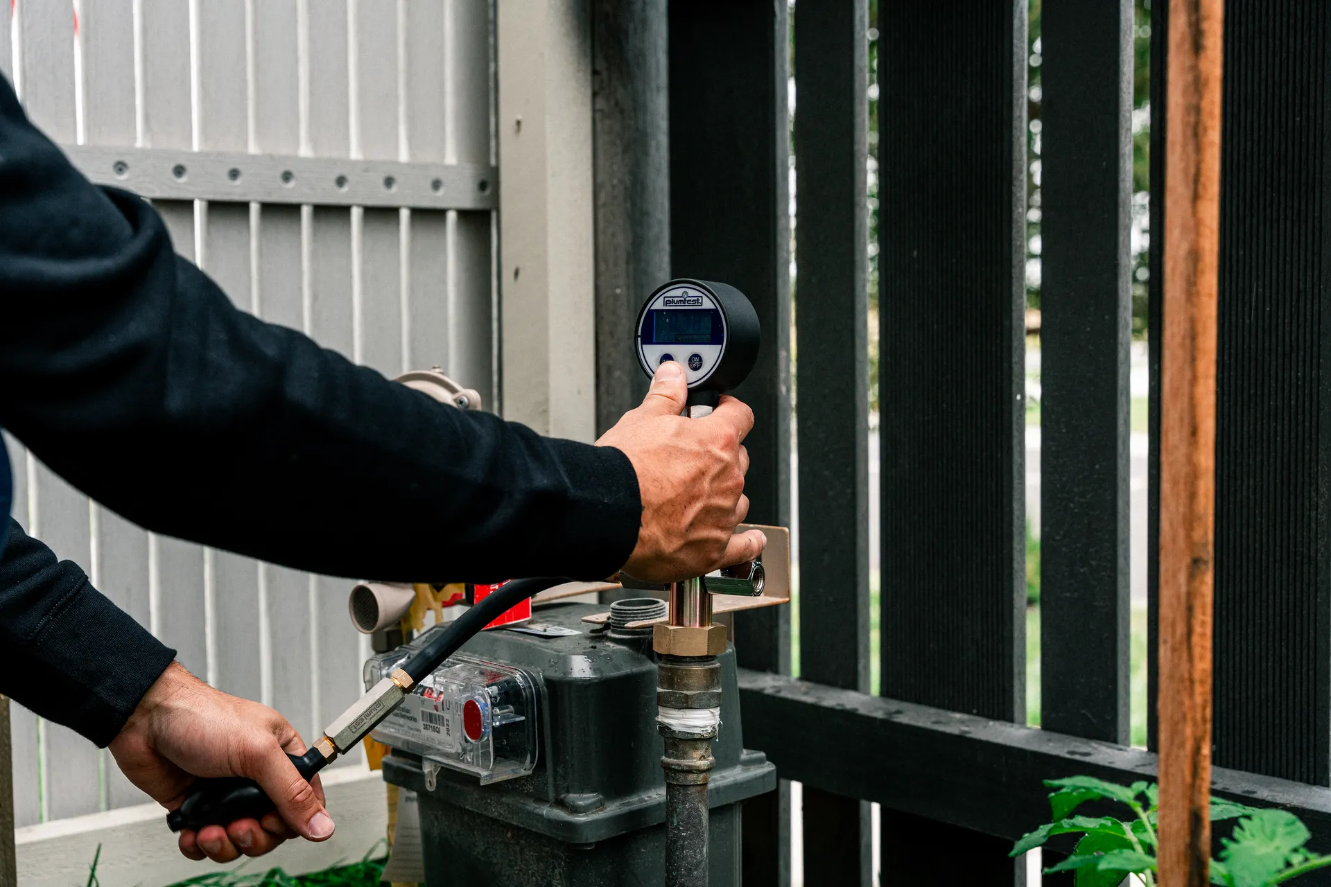 Technician working on ducted gas heating pipework