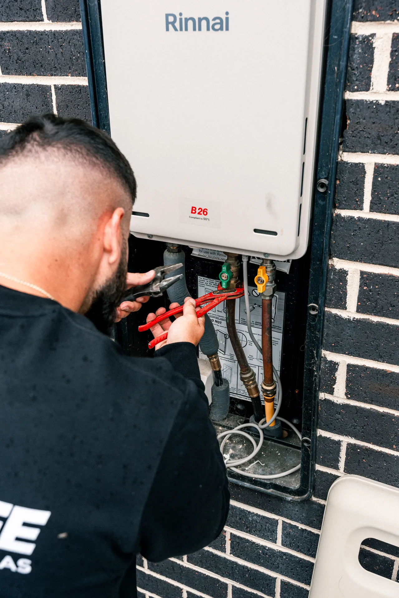 Gas Experts technician working on a gas meter